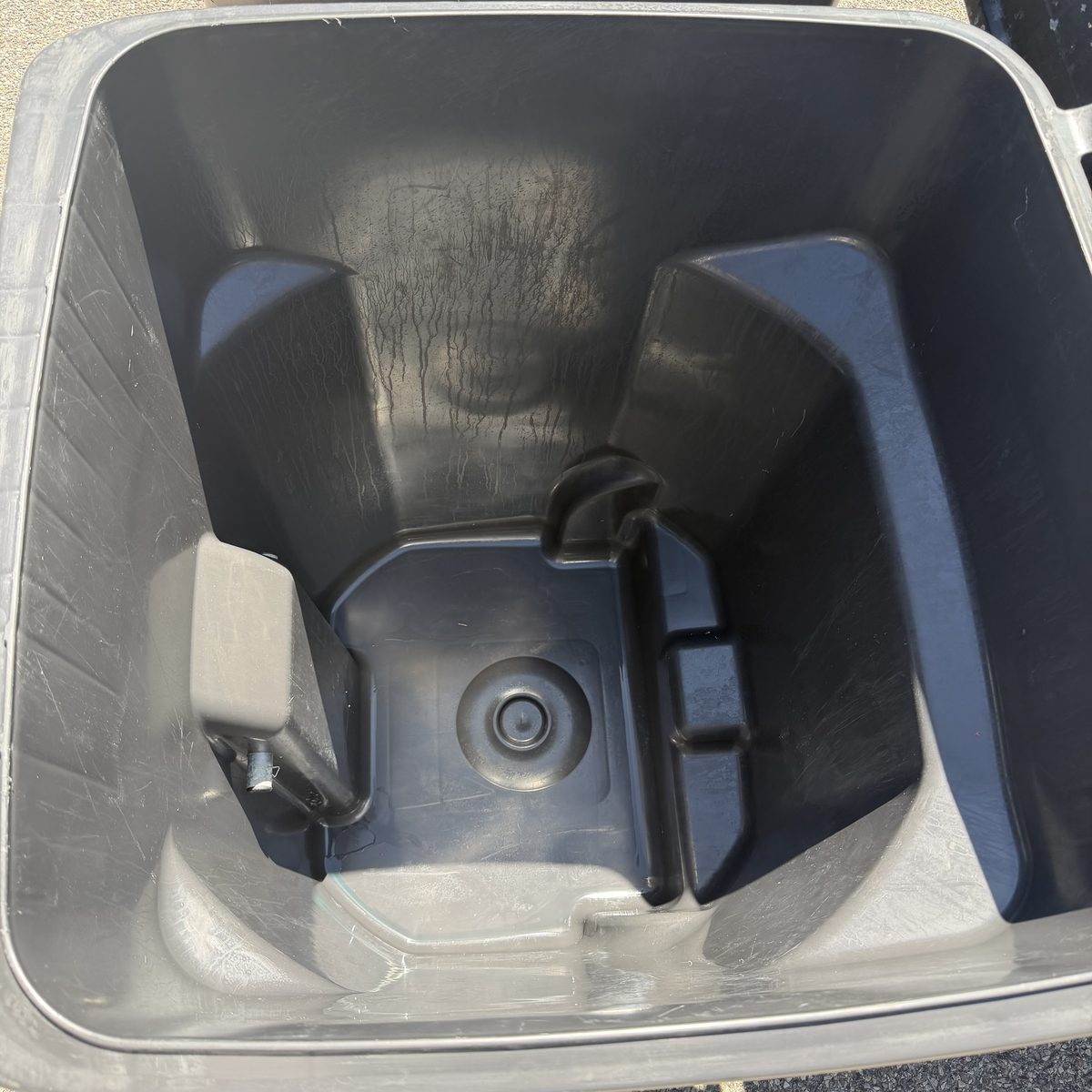 Same garbage can after cleaning — spotless and sanitized